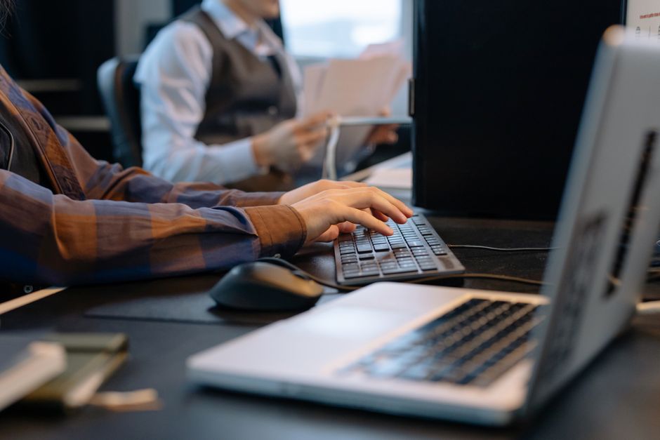 Office workers collaborating on a tech project